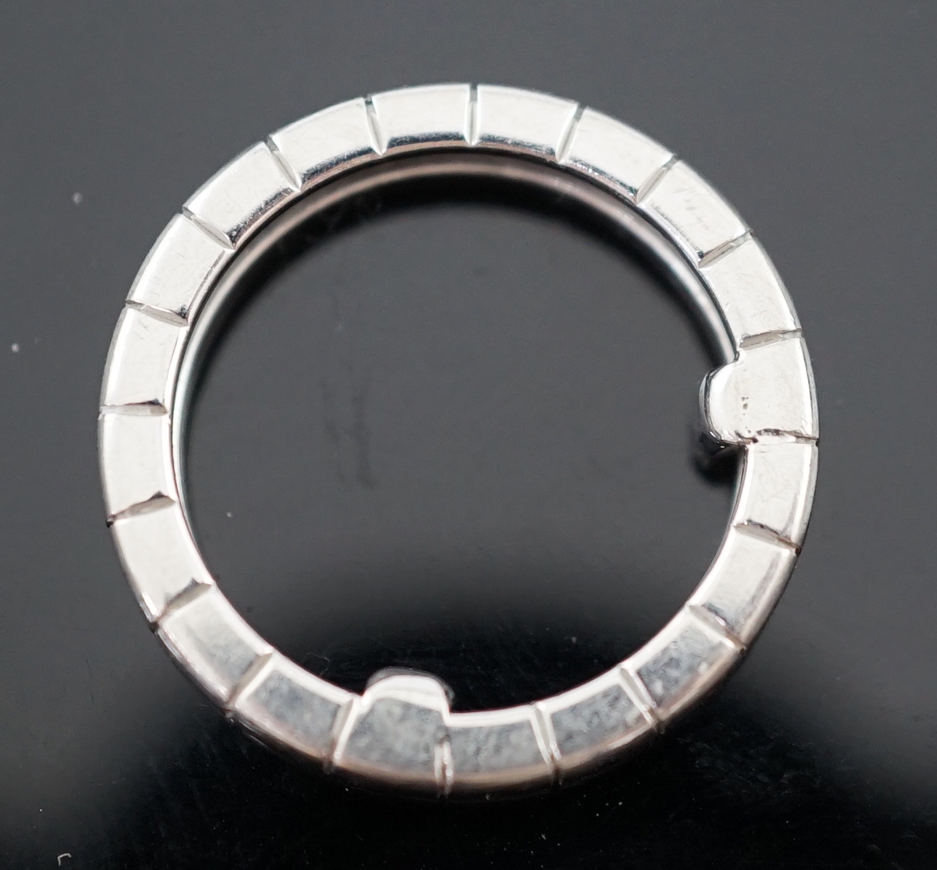 A modern Chopard 18ct white gold and four stone diamond chip cluster set band